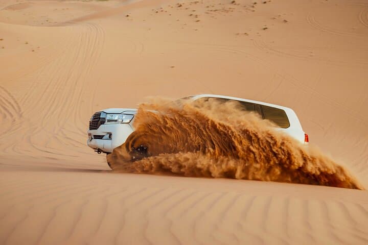 Abu Dhabi Evening Desert Safari: Dune Bashing, Camel Ride & BBQ Under the Stars