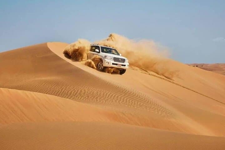 Sunrise Desert Safari in Doha: Camel Ride, Dune Bashing & Sandboarding photo 3