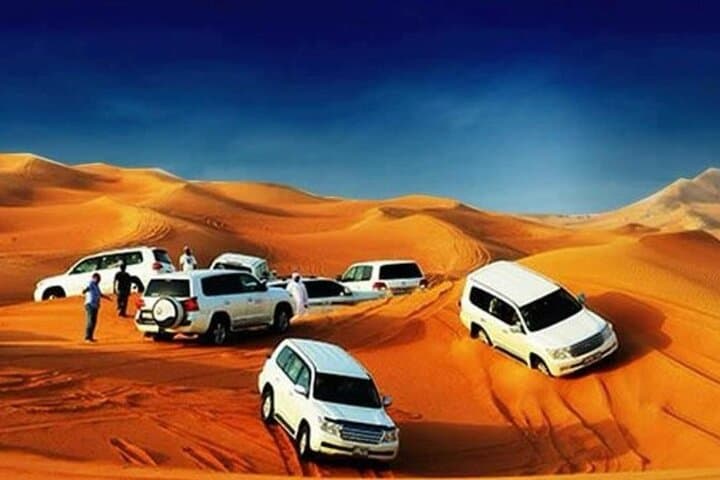 Private Dubai Desert Safari: Dune Bashing, Sandboarding, Camel Rides & VIP Dinner