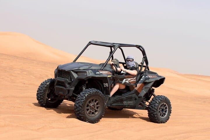 Private Dubai Desert Safari: Dune Bashing, Sandboarding, Camel Rides & VIP Dinner photo 2