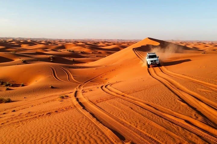 Red Dunes Desert Safari Dubai: Dune Bashing, Sandboarding & Bedouin Camp