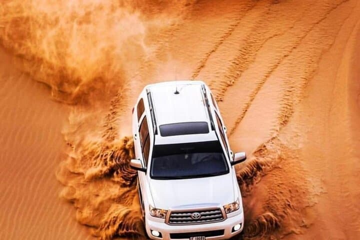 Private Dubai Desert Safari: Dune Bashing, Sandboarding, Camel Rides & VIP Dinner photo 5