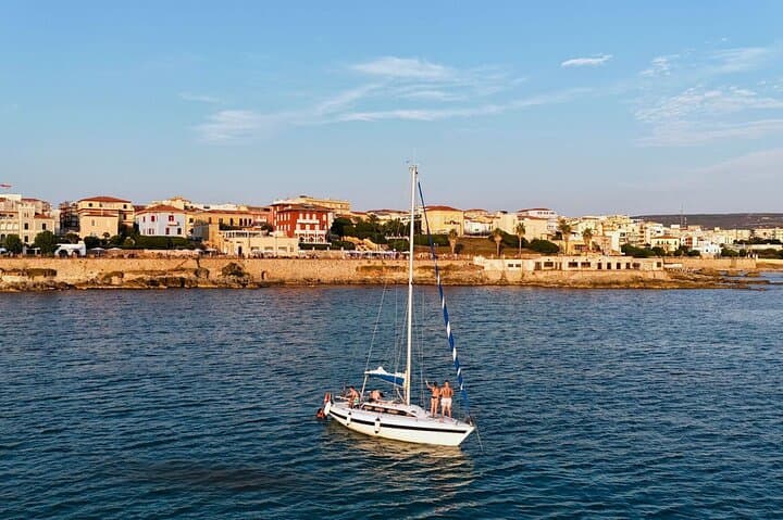 Alghero Sunset Sailing from Fertilia: Porto Conte Evening Cruise & Aperitif