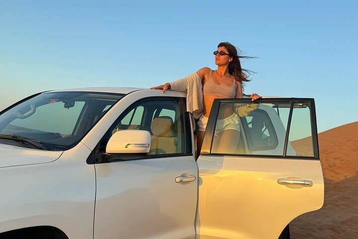 Morning Red Dunes Safari in Lahbab: Dune Bashing, Sandboarding & Camel Ride photo 1