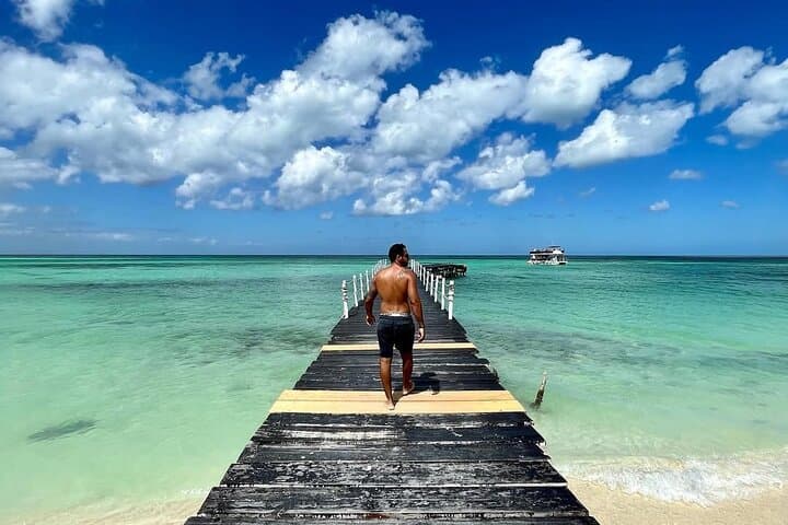Holbox Island Day Trip from Cancun: Boat Ride, Biking & Cenote Swim photo 4