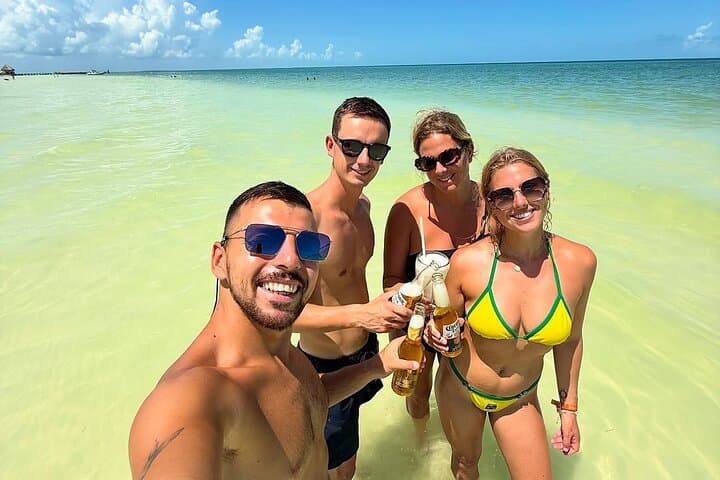 Holbox Island Day Trip from Cancun: Boat Ride, Biking & Cenote Swim photo 3