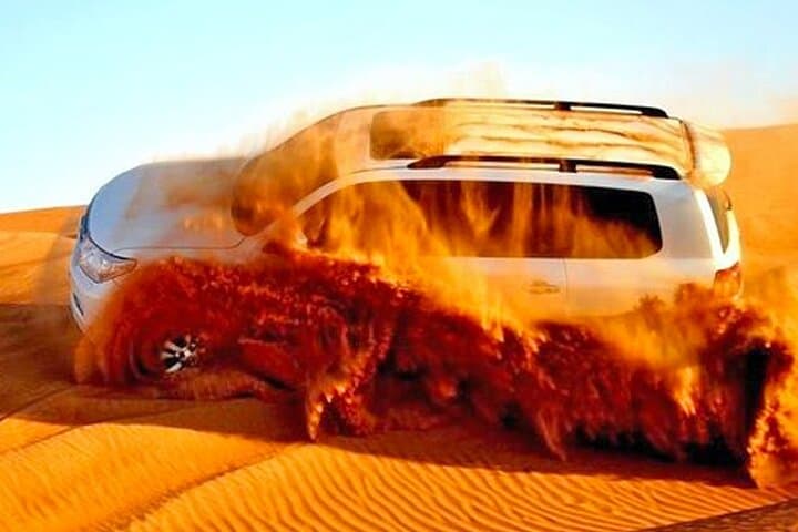 Evening Red Dune Safari in Dubai: Dune Bashing, Camel Ride & Live Desert Show photo 4