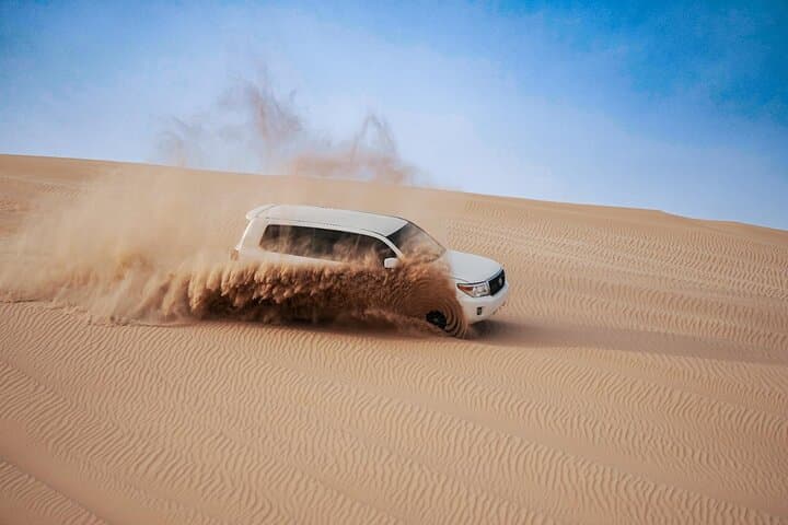 Abu Dhabi Morning Desert Safari and Camel Ride — Dune Bashing, Sandboarding & Camel Farm Visit