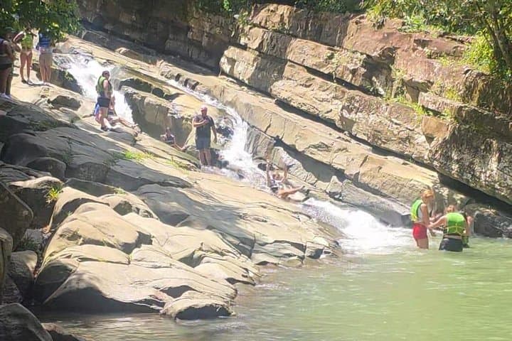 El Yunque Waterslides: Natural Rock Slides & River Swim Day Trip from San Juan photo 1