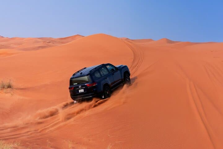 VIP Dubai Desert Safari with Sandboarding, Camel Ride & BBQ Dinner