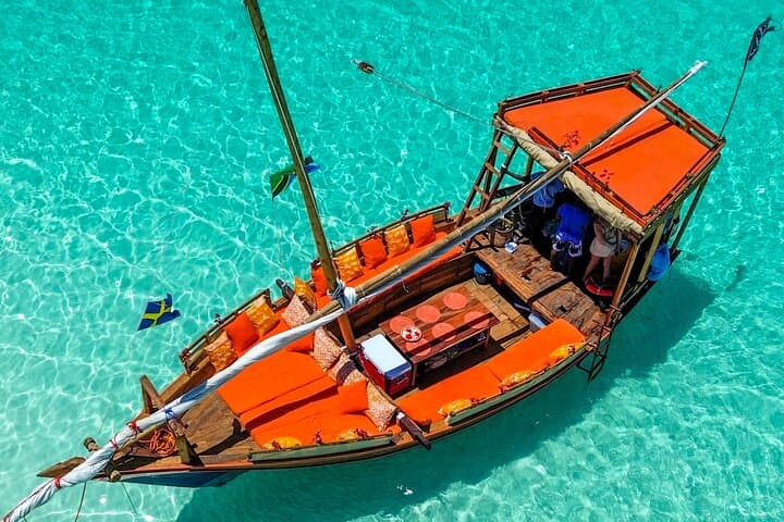 Sailing to Mnemba: Full-Day Dhow Snorkel, Dolphins & Sandbank Adventure
