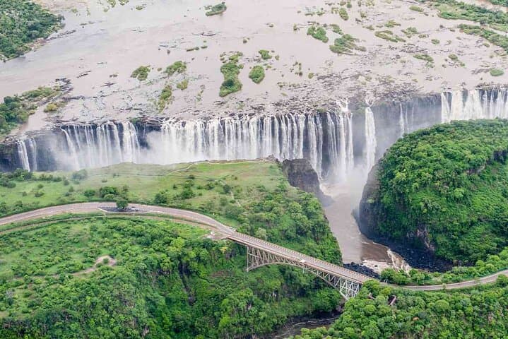 Victoria Falls Guided Tour: Zimbabwe to Zambia Rainforest, Bridge & Zambezi Views photo 3