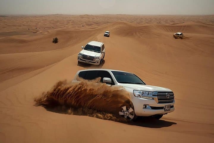 Morning Desert Safari Dubai: Dune Bashing, Sandboarding & Sunrise Camel Ride photo 2