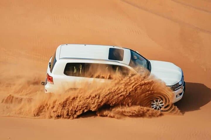 Evening Desert Safari Dubai: Dune Bashing, Camel Rides & Bedouin Camp Experience photo 6