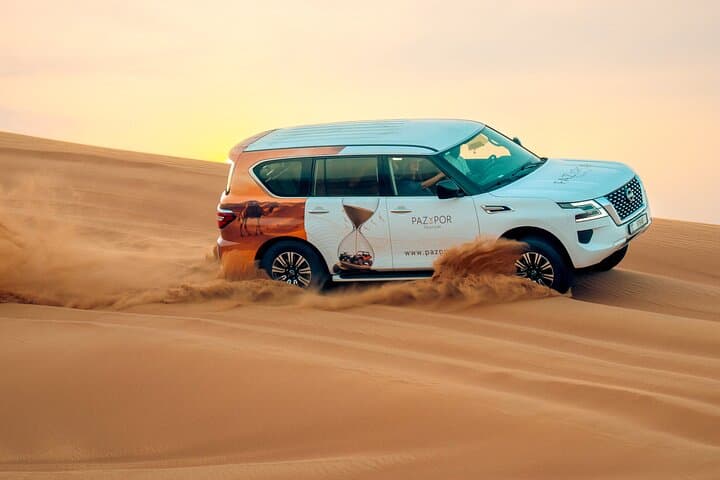 Half-Day Dubai Desert Safari in Lahbab: Dune Bashing, Camel Ride & Sandboarding