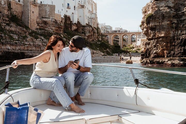 Polignano Between Waves and Clouds: Speedboat Caves and Parasailing Experience photo 2