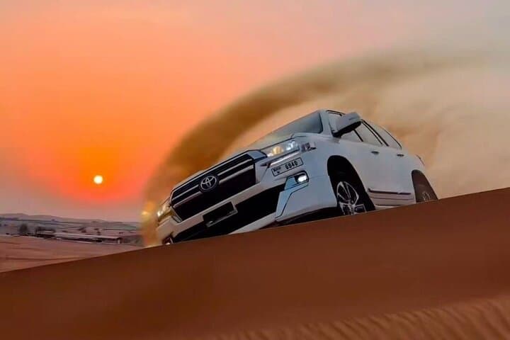 Sunset Desert Safari at Lehbab Red Dunes: Dune Bashing, Camels & BBQ