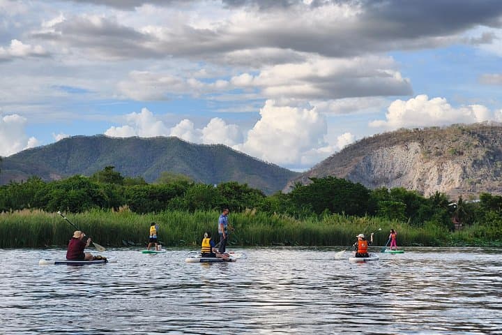 Stand-Up Paddleboarding on the River Kwai: Glide Under Kanchanaburi’s Historic Bridge photo 3
