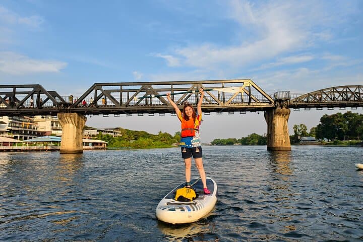 Stand-Up Paddleboarding on the River Kwai: Glide Under Kanchanaburi’s Historic Bridge