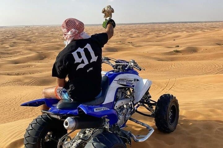 VIP Red Dunes Safari: Quad Biking, Camel Ride & Desert Dinner in Dubai photo 4