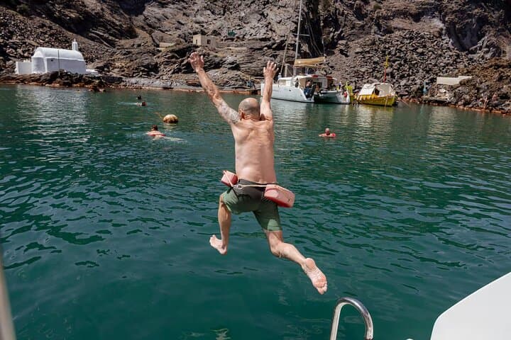 Santorini Catamaran Cruise: Caldera Views, Volcano Swim & BBQ Experience photo 6