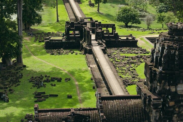 Private Half-Day Angkor Wat and Angkor Thom Tour — Smiling Faces and Jungle Roots photo 5