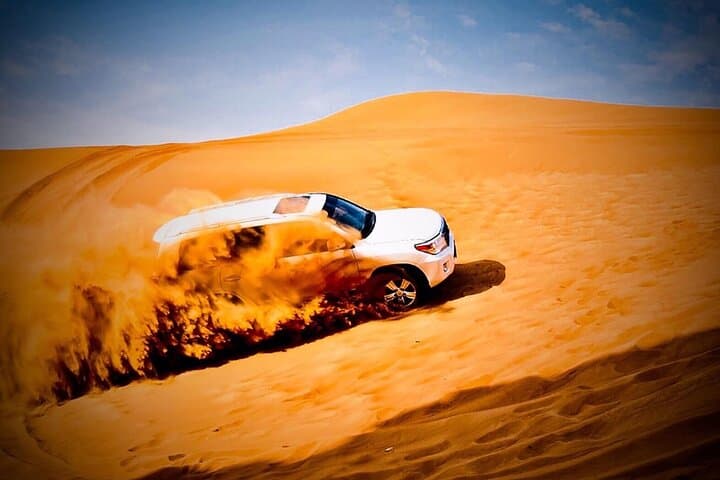 Evening Lahbab Desert Safari: Dune Bashing, Camel Ride & BBQ Under the Stars