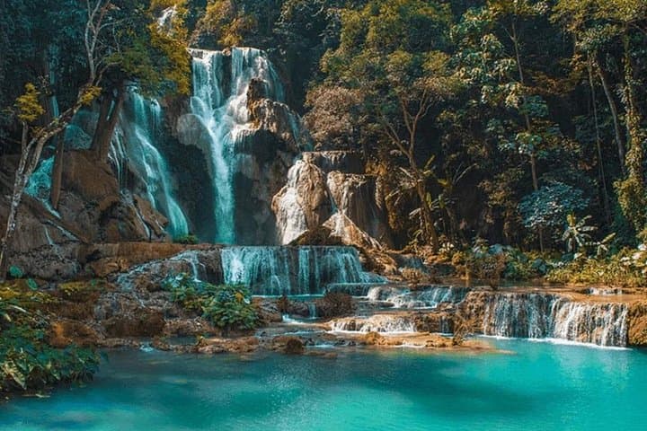 Mekong Longboat to Pak Ou Caves and Kuang Si Waterfalls — Full-Day from Luang Prabang