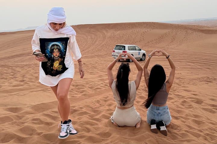 Morning Desert Adventure Dubai — Camel Ride, Dune Bashing & Sandboarding in Lahbab