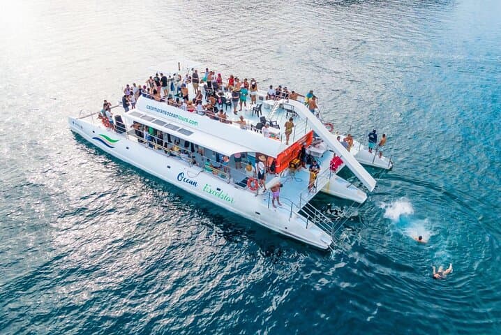 Sunset Catamaran Cruise from Playa Flamingo — Snorkel, Dolphins & Onboard Slide