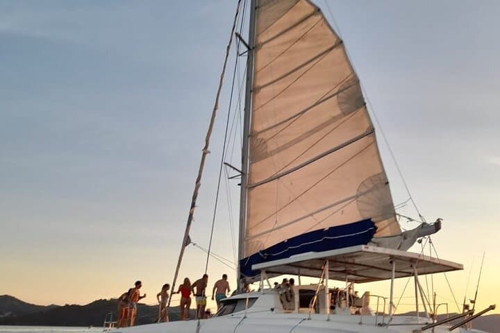 Sunset Catamaran Cruise from Playa Flamingo — Snorkel, Dolphins & Onboard Slide photo 3
