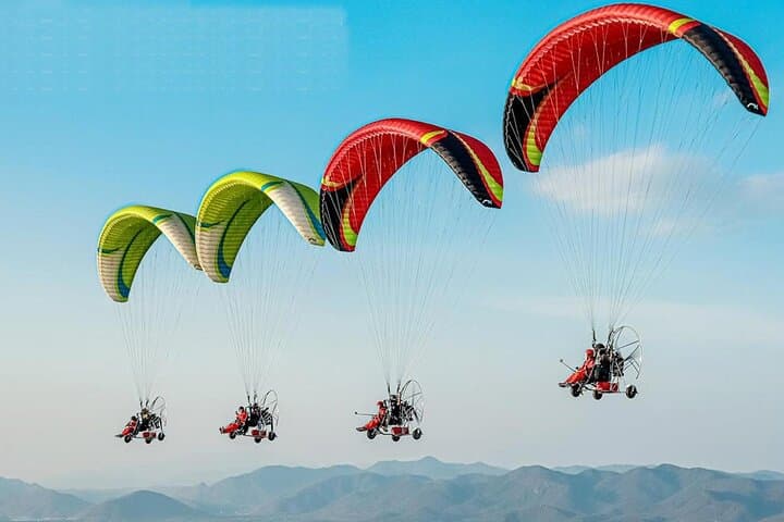 Paramotor Flight Over Vang Vieng — Sunrise & Sunset Paragliding Experience