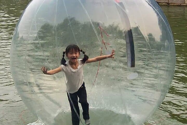 Roll Across the Lake: Inflatable Water Ball Rollers at Downtown OWA, Foley photo 2