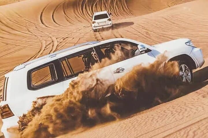 Doha Desert Escape: Gentle Dune Safari, Camel Ride & Sandboarding