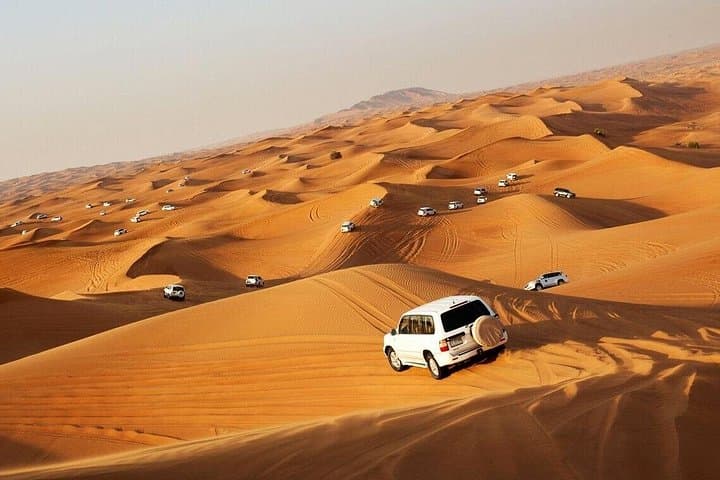 Dubai Evening Desert Safari: Dune Bashing, Camel Ride & BBQ Under the Stars photo 1