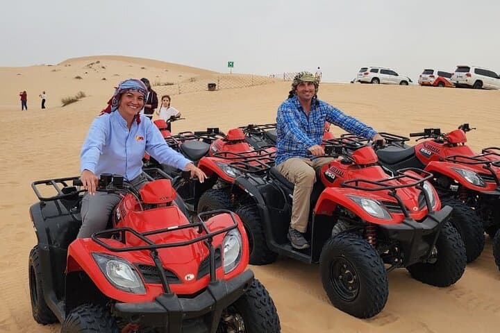 Abu Dhabi Desert Safari with Quad Bike, Camel Ride & BBQ Dinner