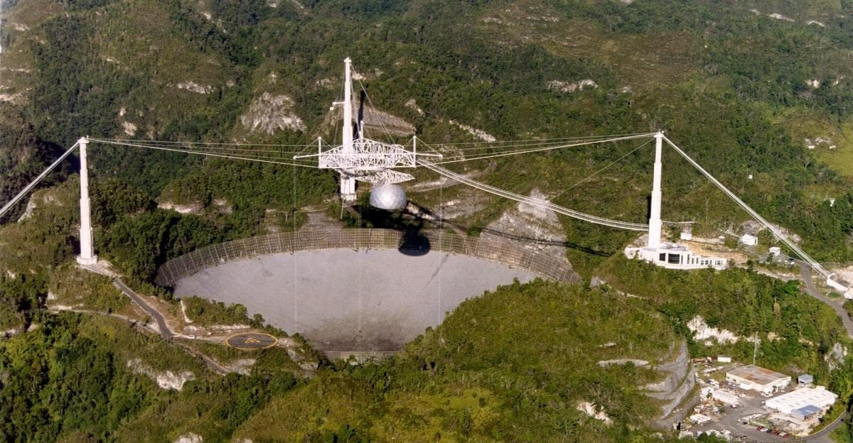 Arecibo Observatory radio dish surrounded by Puerto Rico forest