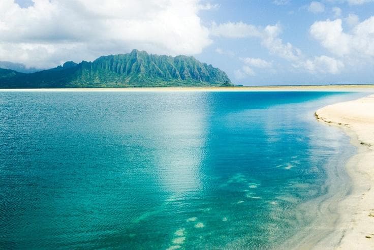 Turquoise tropical lagoon and white sand beach for kayaking tours