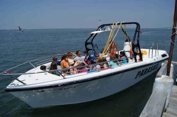 Speedboat cruising near coastal waters for water sports tours