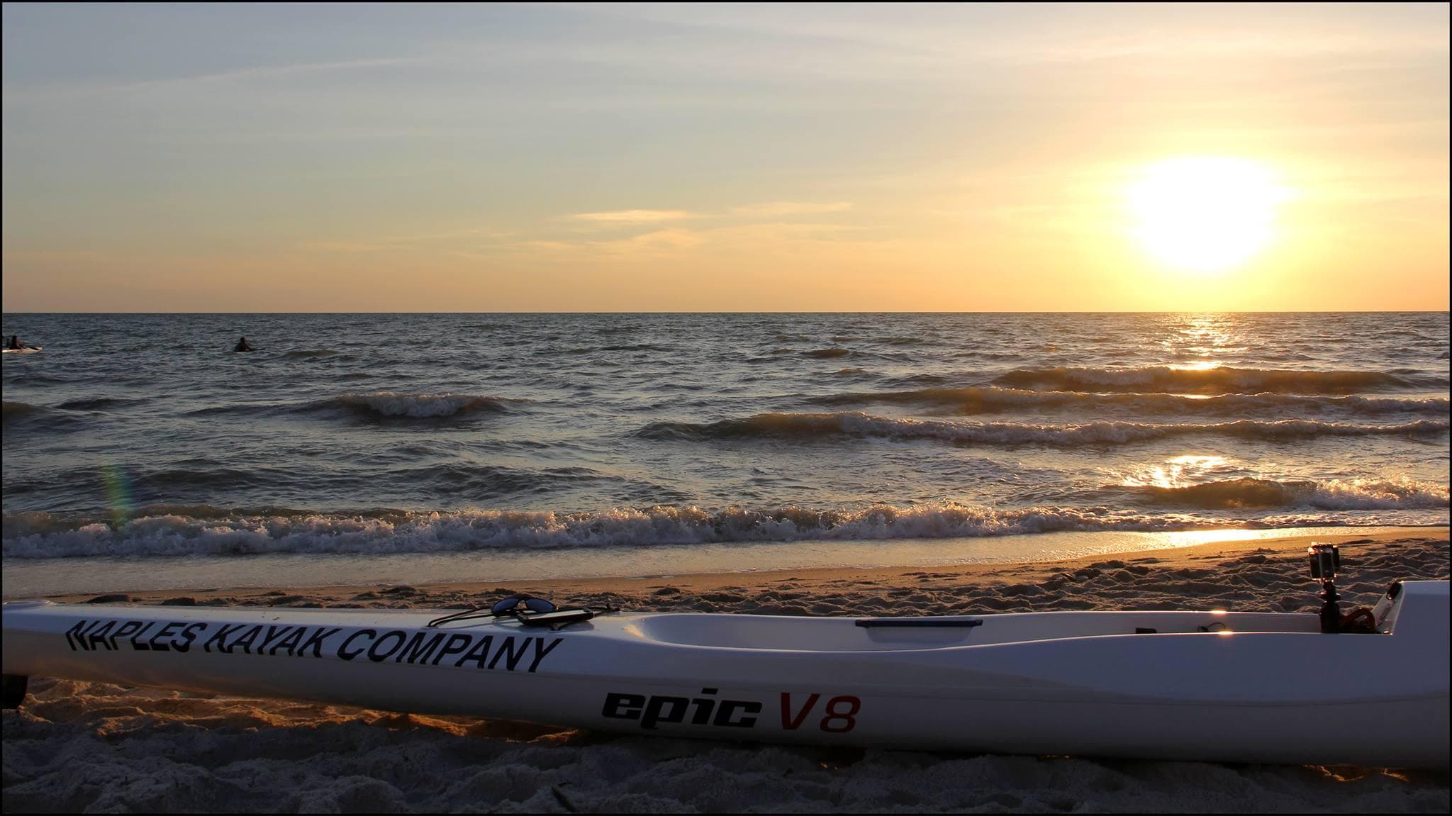 Sunset kayak on Gulf beach at Naples, Florida shoreline