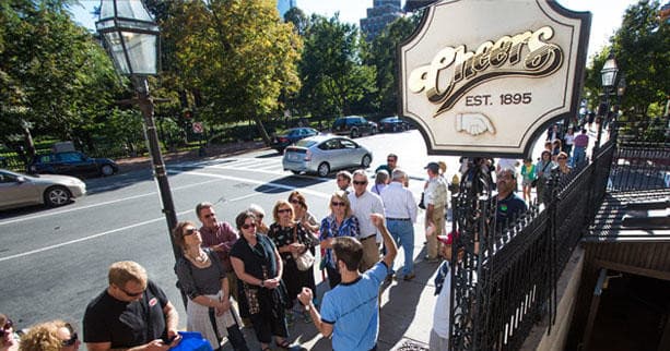 Tour group outside Cheers bar on Boston walking locations tour