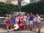 Friends by city fountain in downtown Nashville during group crawl