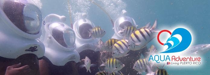 Sea helmet underwater walk with fish in coral reef setting