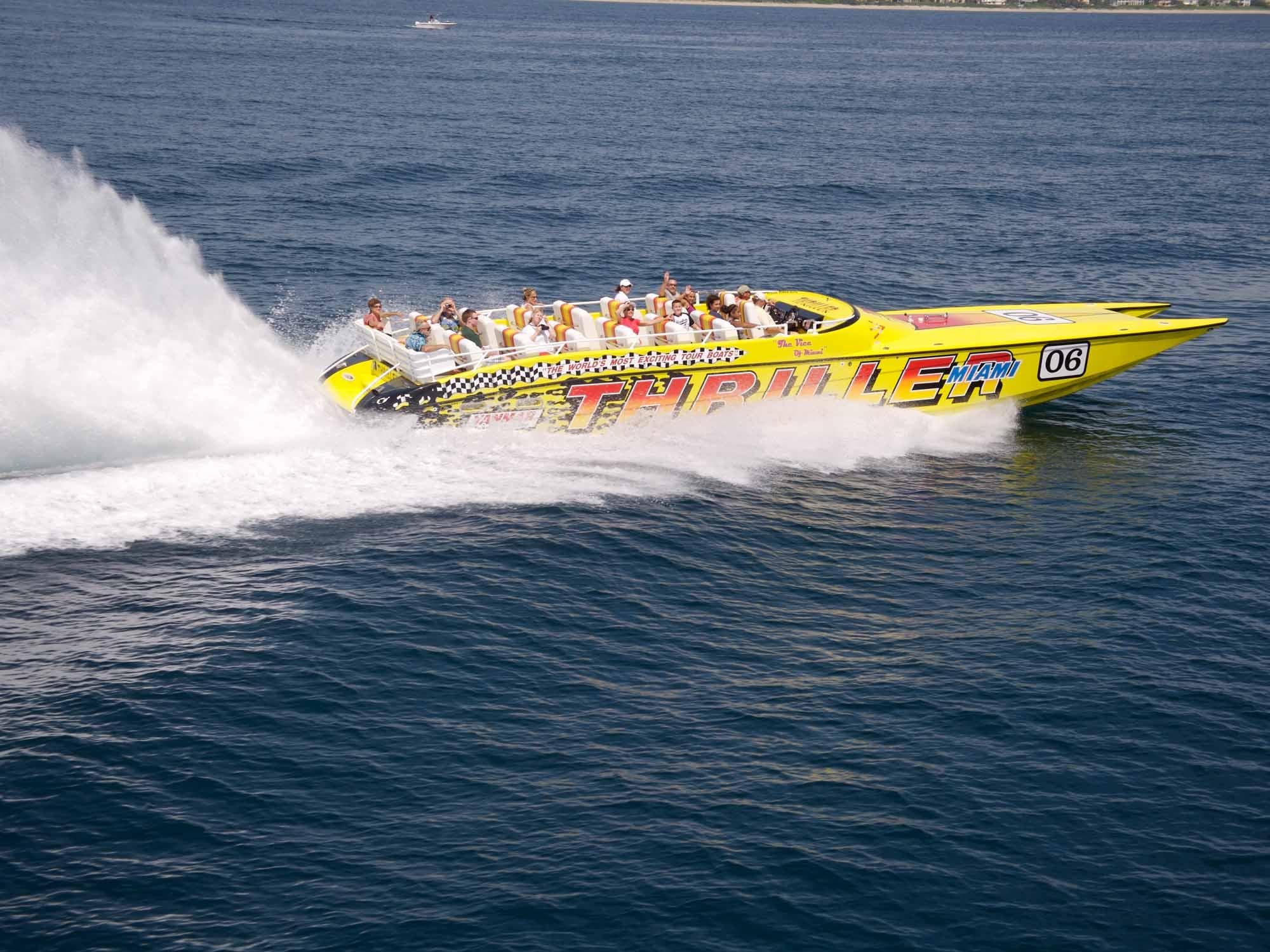 Yellow Thriller powerboat racing fast across open ocean