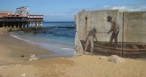 Beach mural and pier on Monterey coastline, scenic seaside walk