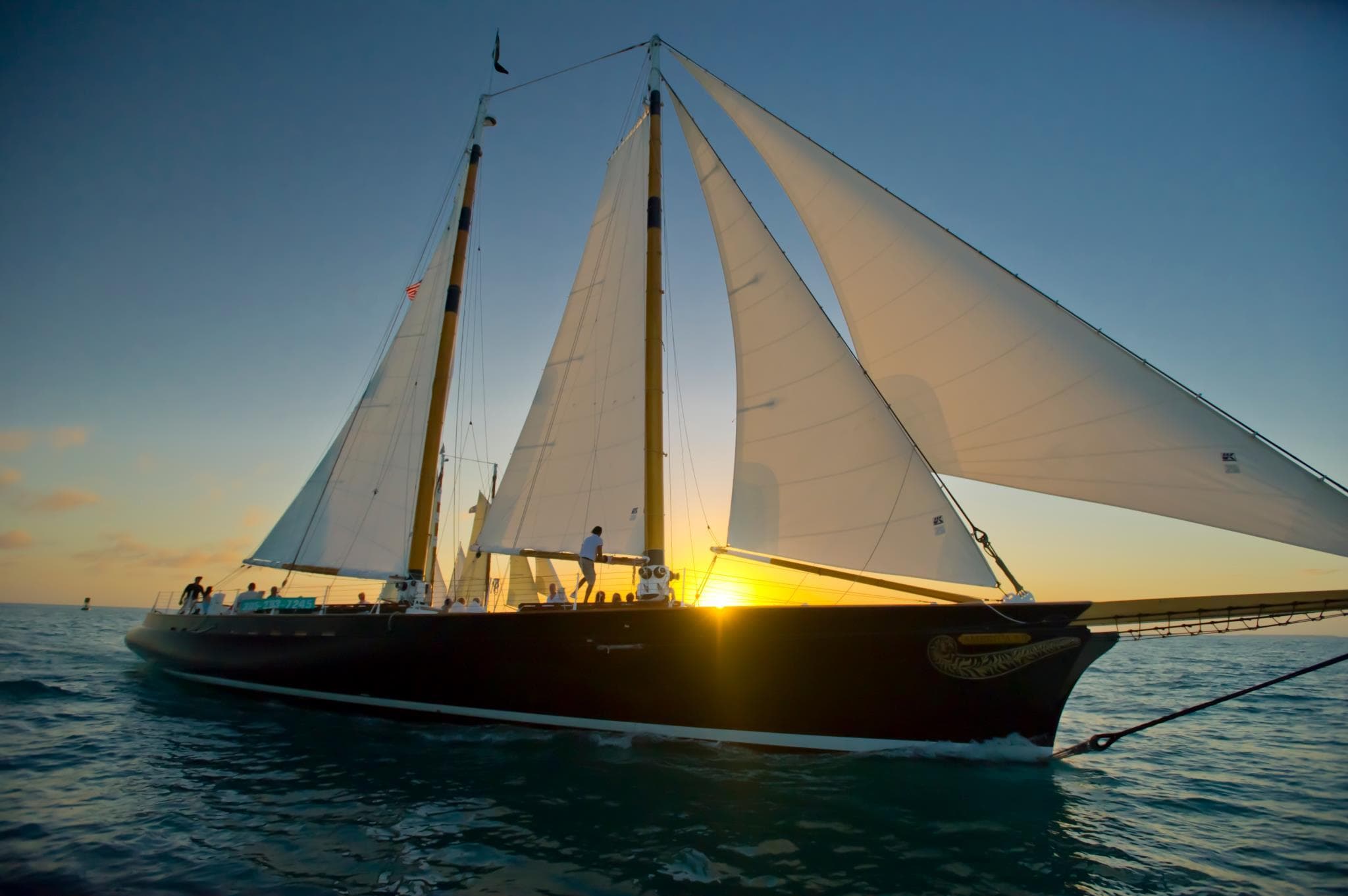 Classic schooner sailing at sunset off Key West coast