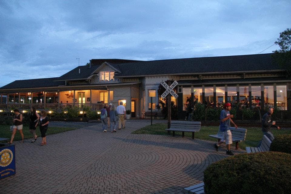 Harborfront visitor plaza at Seneca Harbor Station at dusk