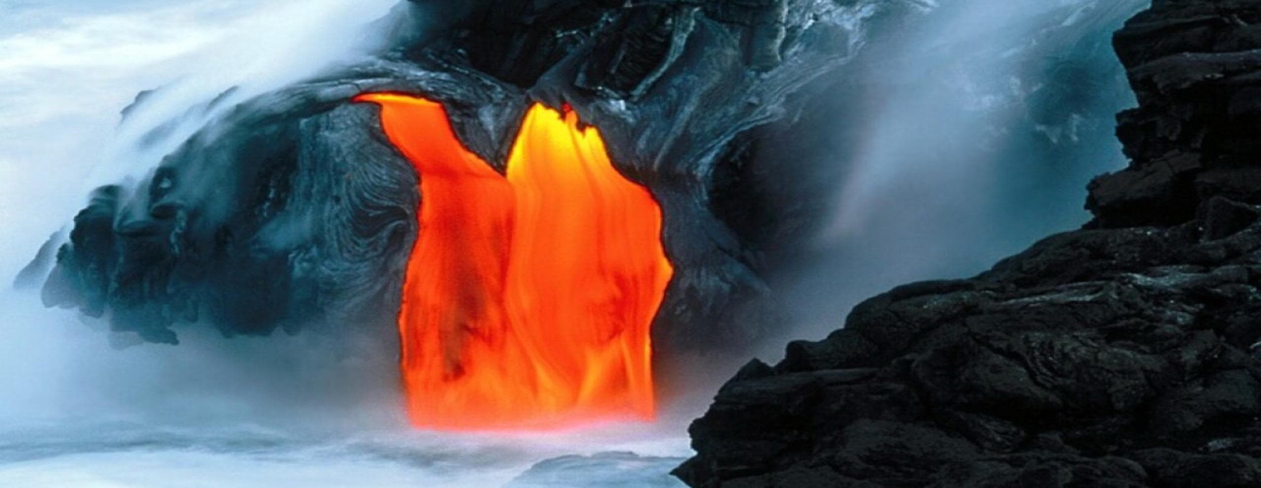 Molten lava flowing into ocean on volcanic coastline, dramatic