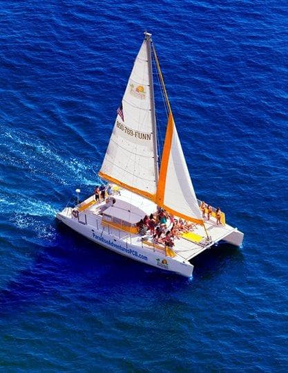 Aerial catamaran tour on deep blue Caribbean-style open ocean