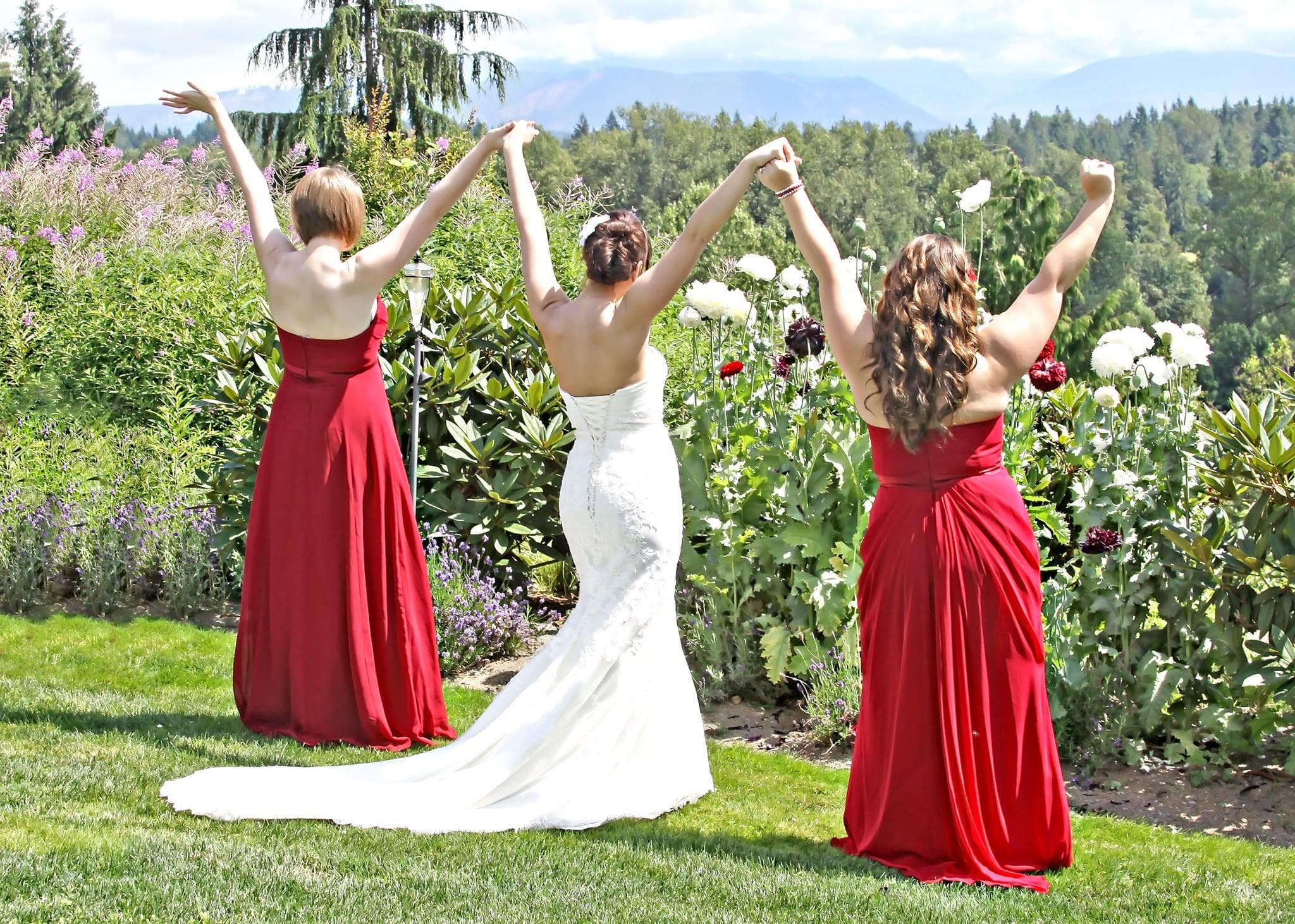 Bridal party celebrating outdoors in garden at winery venue